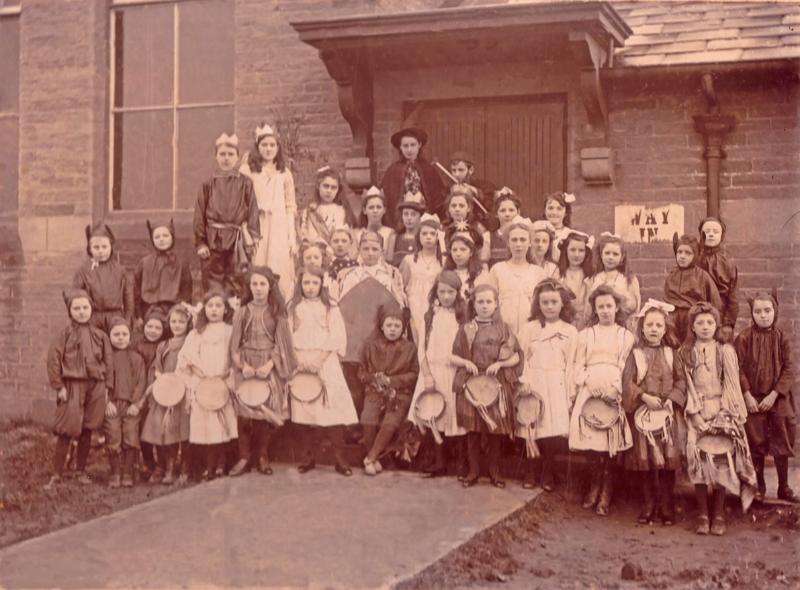 School Fancy Dress.JPG - School Fancy Dress  Middle row:  With star in hair is Anntrip Gane  Front row:  4th from left is Mrs Foster - 6th from left is Mrs Howgarth  Front row:  3rd from right is Bell harrison - 2nd from right is Judith Gane  ( Does anyone know the date, or  who the rest of the children are? ) 